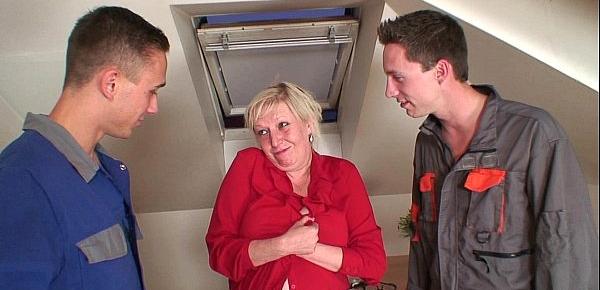  Two repairmen fuck busty grandma from both ends